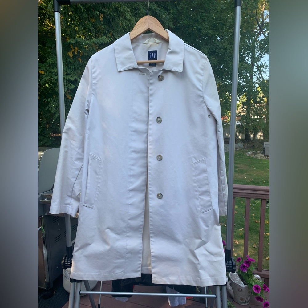 Cream trench coat.